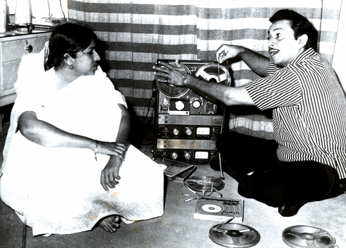 Madan Mohan listening to newly recorded song at home with Lataji on his Akai Spool recorder.