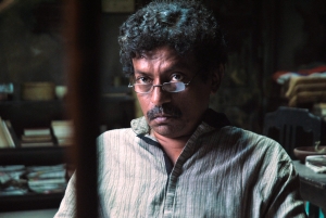 The mad poet (played by director Goutam Ghosh) in Baishe Srabon